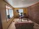 Bright dining area with brick accent wall and window seat at 1964 E Lakeside Dr, Decatur, GA 30032