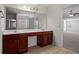 Double vanity bathroom with dark wood cabinets at 221 Cutbank Sw Ct, Atlanta, GA 30331