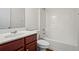 Clean bathroom with a tub and wood vanity at 221 Cutbank Sw Ct, Atlanta, GA 30331