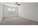 Bedroom with large window and ceiling fan at 221 Cutbank Sw Ct, Atlanta, GA 30331