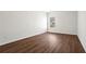 Large bedroom with hardwood floors and a window at 221 Cutbank Sw Ct, Atlanta, GA 30331