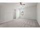 Bright bedroom featuring a ceiling fan and closet at 221 Cutbank Sw Ct, Atlanta, GA 30331