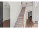 Bright and spacious entryway with hardwood floors and staircase at 221 Cutbank Sw Ct, Atlanta, GA 30331