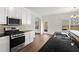 Bright kitchen, featuring stainless steel appliances and dark granite countertops at 221 Cutbank Sw Ct, Atlanta, GA 30331