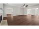 Open concept living area with hardwood floors, fireplace, and views into dining and kitchen at 221 Cutbank Sw Ct, Atlanta, GA 30331