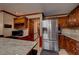 Kitchen with granite countertops, stainless steel refrigerator, and wooden cabinets at 4335 Commodore Rd, Powder Springs, GA 30127