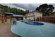 Relaxing pool area with wooden deck and shed at 4335 Commodore Rd, Powder Springs, GA 30127