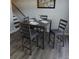 Simple gray four-person dining set in a well-lit space at 1625 Conley Rd # 138, Conley, GA 30288