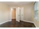 Bedroom with hardwood floors and access to a closet and another room at 1927 Vicki Se Ln, Atlanta, GA 30316