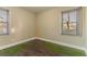 Well-lit bedroom featuring dark hardwood floors and two windows at 1927 Vicki Se Ln, Atlanta, GA 30316