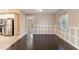 Dining area with dark hardwood floors and view into kitchen at 1927 Vicki Se Ln, Atlanta, GA 30316