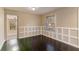 Dining room with dark hardwood floors and wainscoting at 1927 Vicki Se Ln, Atlanta, GA 30316