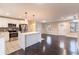 Open living room with dark hardwood floors and an updated kitchen at 1927 Vicki Se Ln, Atlanta, GA 30316