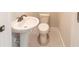 Simple bathroom with pedestal sink and toilet at 4392 Navajo Se Ln, Acworth, GA 30102