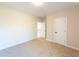 Well-lit bedroom with neutral walls and carpet flooring at 4392 Navajo Se Ln, Acworth, GA 30102