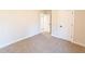 Bright bedroom with carpet and doors to hallway and bathroom at 4392 Navajo Se Ln, Acworth, GA 30102