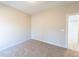 Well-lit bedroom featuring carpeted floors and an additional doorway at 4392 Navajo Se Ln, Acworth, GA 30102