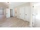 Bright hallway with light gray floors and white doors at 4392 Navajo Se Ln, Acworth, GA 30102