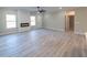 Spacious living room with hardwood floors, electric fireplace, and large windows at 4392 Navajo Se Ln, Acworth, GA 30102