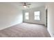 Bright and airy bedroom with ceiling fan and carpet at 4802 Larkin Pass, Buford, GA 30518