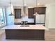 Modern kitchen with island and stainless steel appliances at 4802 Larkin Pass, Buford, GA 30518