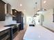 Modern kitchen with stainless steel appliances and a large island at 4802 Larkin Pass, Buford, GA 30518