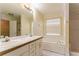 Main bathroom with double vanity and garden tub at 2216 Mcdaniel Mill Sw Rd, Conyers, GA 30094