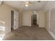 Large bedroom with ample closet space and neutral walls at 2216 Mcdaniel Mill Sw Rd, Conyers, GA 30094