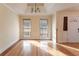 Bright dining room with hardwood floors and large windows at 2216 Mcdaniel Mill Sw Rd, Conyers, GA 30094