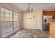 Bright dining area with tile floor and chandelier at 2216 Mcdaniel Mill Sw Rd, Conyers, GA 30094