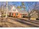 Front view of house showcasing yard and landscaping at 2216 Mcdaniel Mill Sw Rd, Conyers, GA 30094