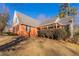 Side view of brick and shingle two-story house at 2216 Mcdaniel Mill Sw Rd, Conyers, GA 30094