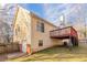 House exterior showcasing a two-story home with a deck and attached garage at 2216 Mcdaniel Mill Sw Rd, Conyers, GA 30094