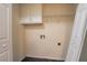 Laundry room with washer/dryer hookups and shelving at 2216 Mcdaniel Mill Sw Rd, Conyers, GA 30094