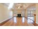 Living room with hardwood floors, fireplace and deck access at 2216 Mcdaniel Mill Sw Rd, Conyers, GA 30094