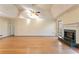 Spacious living room with hardwood floors and fireplace at 2216 Mcdaniel Mill Sw Rd, Conyers, GA 30094