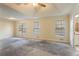 Main bedroom with high ceiling, fan and access to bathroom at 2216 Mcdaniel Mill Sw Rd, Conyers, GA 30094