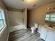 Clean bathroom with white vanity, bathtub, and toilet at 2308 Lakewood Sw Ave, Atlanta, GA 30315