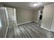 Simple bedroom with neutral walls and wood-look floors at 2308 Lakewood Sw Ave, Atlanta, GA 30315