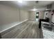 Open living area with gray walls and wood-look floors at 2308 Lakewood Sw Ave, Atlanta, GA 30315