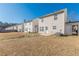 Row of townhouses with grassy backyards and patios at 320 Goldenrod Dr, Stockbridge, GA 30281