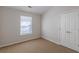 Bright bedroom with double door closet and neutral walls at 320 Goldenrod Dr, Stockbridge, GA 30281