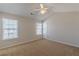 Bright bedroom with vaulted ceilings, carpet, and two windows at 320 Goldenrod Dr, Stockbridge, GA 30281