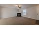 Living room with corner fireplace and ceiling fan at 320 Goldenrod Dr, Stockbridge, GA 30281