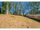 Sloped backyard, offering privacy and nature views at 3488 Brookfield Ln, Decatur, GA 30032