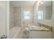 Clean bathroom with granite countertop, tile shower/tub, and flooring at 3488 Brookfield Ln, Decatur, GA 30032