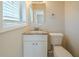 Clean bathroom with granite countertop and white vanity at 3488 Brookfield Ln, Decatur, GA 30032