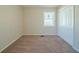 Bright bedroom with neutral walls, carpeting, and double-door closet at 3488 Brookfield Ln, Decatur, GA 30032