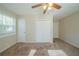 Bright bedroom with carpet flooring, ceiling fan and closet at 3488 Brookfield Ln, Decatur, GA 30032