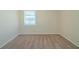 Simple bedroom with neutral walls and carpeting, featuring a window at 3488 Brookfield Ln, Decatur, GA 30032